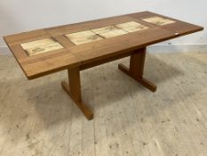 AM Mobler, a Danish teak and tile top extending dining table, raised on panel end and sledge