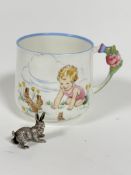 A Paragon china child's Eileen Soper Play Time series mug, decorated with three baby bunny rabbits