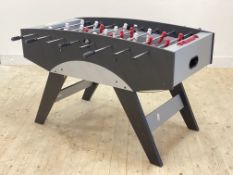 A table football table, H83cm, L138cm, D103cm