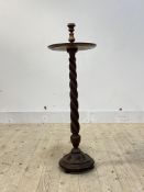 An early 20th century spiral turned mahogany floor standing candle stick H90cm