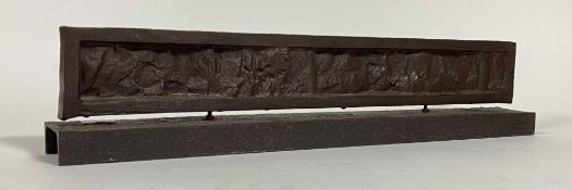 An industrial abstract bronzed cast metal sculpture, on a cast iron channel section base,