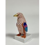 A Herend porcelain model of a Penguin in a orange pattern with gilt beak and claws. (h including