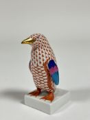 A Herend porcelain model of a Penguin in a orange pattern with gilt beak and claws. (h including