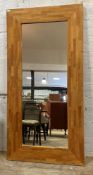 A large contemporary upright wall mirror, 199cm x 100cm