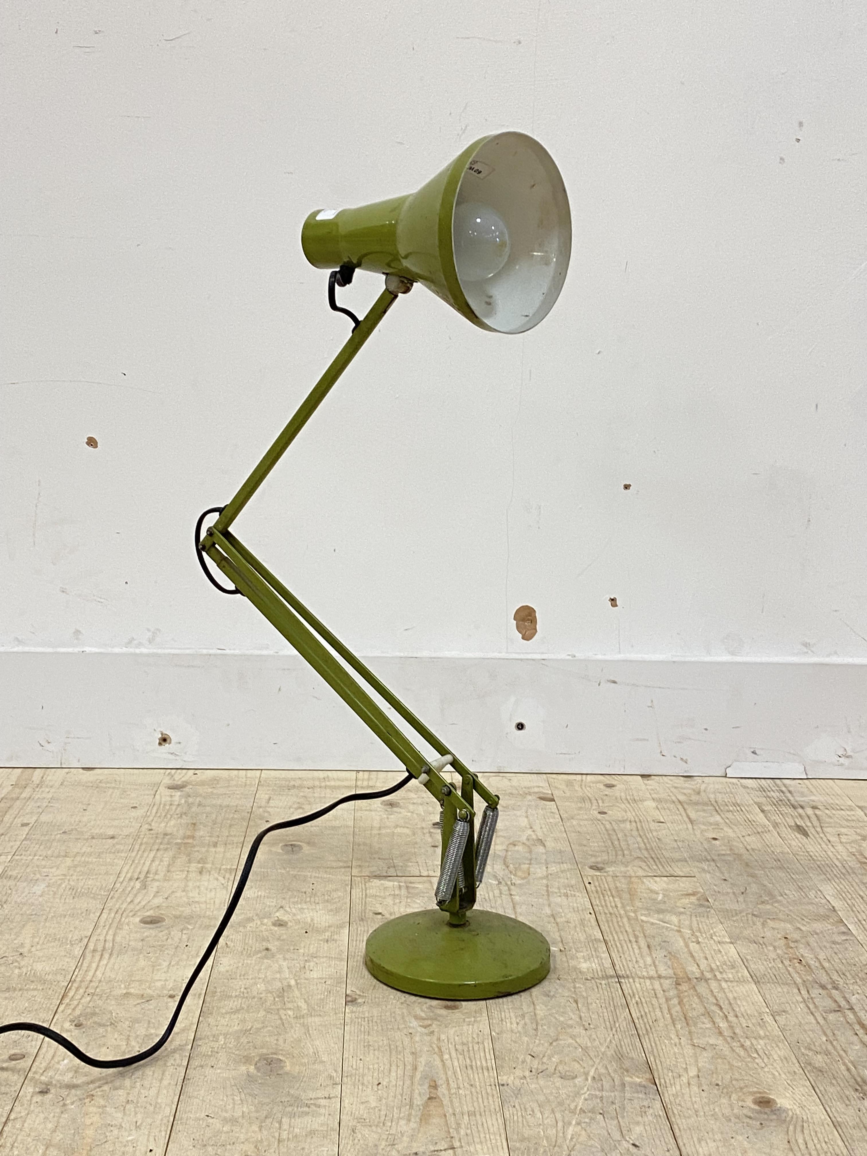 A vintage anglepoise lamp, in green
