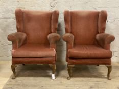 A pair of Queen Anne style wingback chairs, upholstered in pink velure, raised on cabriole supports,