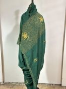 An Indian green crepe de chine silk Sari with gilt wire worked scrolling panel, lotus flowers to