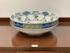 A late 19th century Sutherland Ivory porcelain basin, the well transfer printed with floral swags