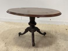 A Victorian mahogany loo table, the oval top on baluster column and three splayed supports moving on