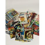 A large collection of various comic books such as a few DC Superman, Strange tales of Suspense,