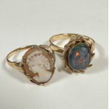 A 9ct dress ring set oval cameo, (O), and a yellow metal opal cabouchon ring with scrolling 1970s