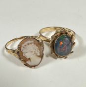 A 9ct dress ring set oval cameo, (O), and a yellow metal opal cabouchon ring with scrolling 1970s