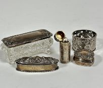 A Victorian silver cylinder scent case with engraved floral sprays, complete with original glass