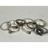 A group of eight silver rings including two rope pattern, three semi precious gem stone set rings,