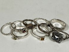 A group of eight silver rings including two rope pattern, three semi precious gem stone set rings,