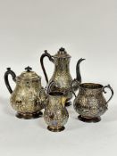 An Epns four piece tea and coffee service of baluster form, the stylised floral and C scroll