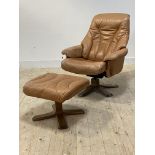 A reclining chair and footstool, upholstered in tan leather, by Soderbergs of Sweden