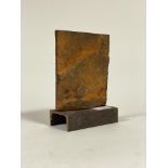 An Industrial abstract patinated cast iron sculpture on a channel section base, H21cm