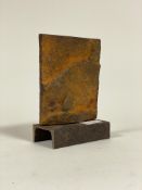 An Industrial abstract patinated cast iron sculpture on a channel section base, H21cm
