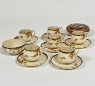 A set of six Japanese satsuma coffee cans and saucers decorated with Autumn sprays of acer tree with
