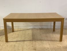A contemporary oak veneered extending dining table on square section supports, h74cm, 176cm x 96cm