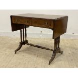 A reproduction Georgian style walnut and mahogany sofa table, with two drawers opposed by two