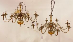 A pair of mid to late 20th century Dutch style laquered brass chandeliers, with eight scrolling