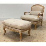 A French style fauteuil armchair, the limed oak frame enclosing natural linen upholstery, retailed