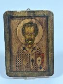 A modern Russian style pine painted and gilded icon depicting Saint, unsigned, (26cm x 19cm x 2.