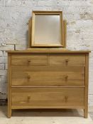 A contemporary solid hardwood chest, fitted with two short and three long drawers, raised on stile
