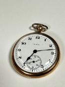 An Elgin yellow metal open faced pocket watch, white enamel dial with Arabic numerals and