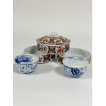 Three Japanese decorated shallow dishes with one cover, (h 4.5cm excluding cover x 14.5cm) and a