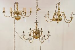 A pair of Dutch style brass chandeliers, with six branches, (D63cm) together with a similar