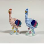 A pair of Herend Emu porcelain figures, one in a blue pattern the other in orange, both have