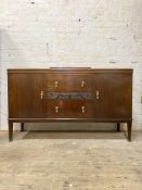 A 1930's mahogany sideboard of Georgian design, three centre drawers flanked by two cupboards,