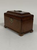 A George III mahogany tea caddy, original brass swing handle and escutcheon, caddy top opening to
