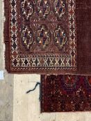 A Turkoman hand knotted bag face rug, typically decorated with guls, (112cm x 77cm) together with