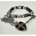 A Scottish agate barrel style bracelet with white metal mounts, (L 22cm) a Scottish style white