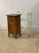 An oak bedside cabinet fitted with two drawers and cupboard on stile supports, (H79cm) together with