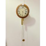 A 19th century mahogany wag on the wall clock, the white painted dial with Roman chapter ring,