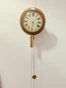 A 19th century mahogany wag on the wall clock, the white painted dial with Roman chapter ring,