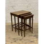 A 20th century mahogany nest of three tables, the smallest fitted with a drawer, H62cm, W50cm,