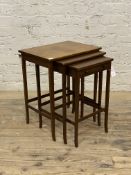 A 20th century mahogany nest of three tables, the smallest fitted with a drawer, H62cm, W50cm,