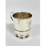 A Birmingham 1928 silver tapered cylinder christening cup with C scroll handle to side with engraved