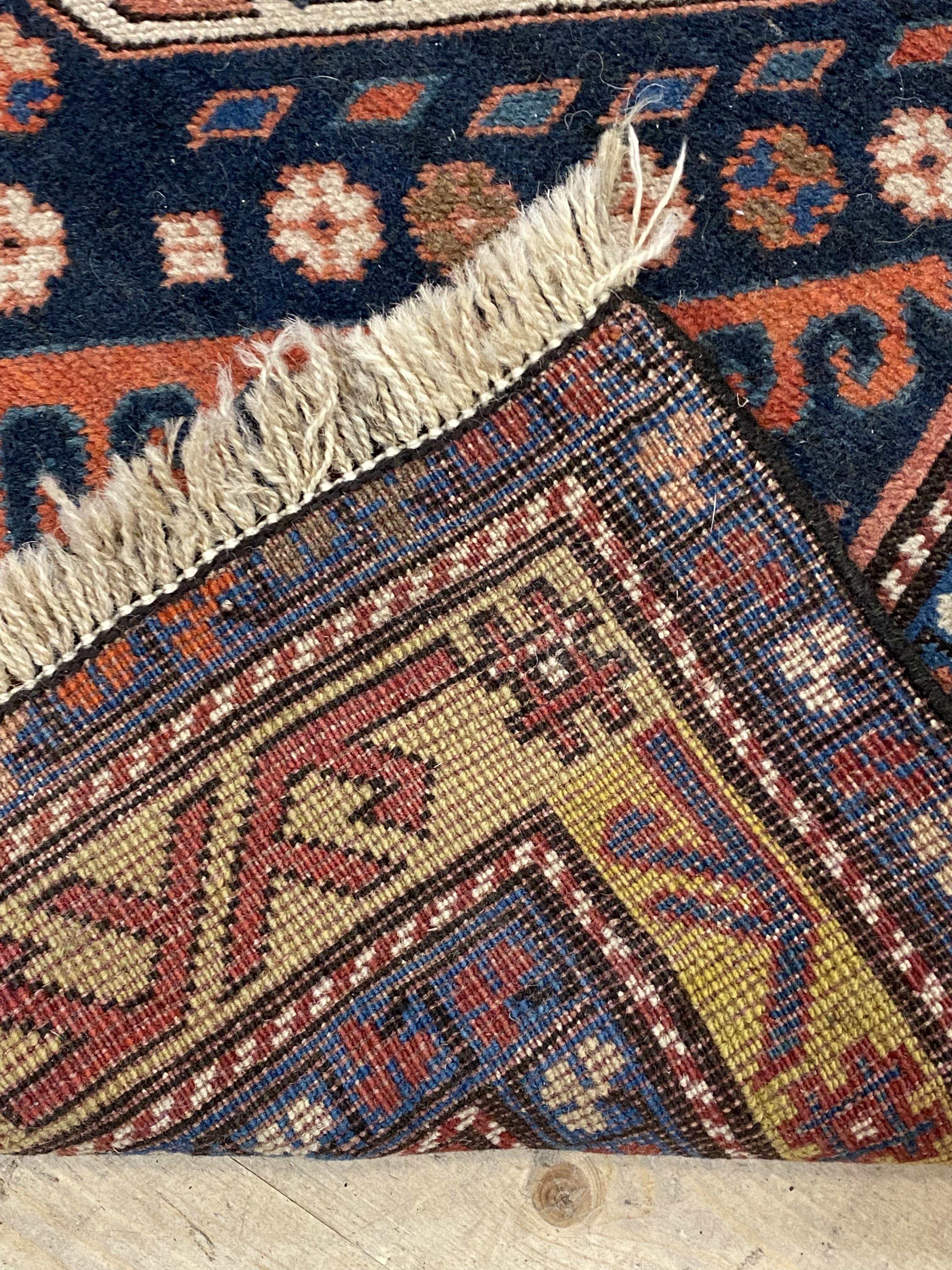 A hand woven Caucasian rug of geometric design with multi line border, 223cm x 124cm - Image 3 of 3