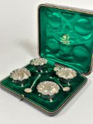 A set of four Epns scalloped bead rimmed miniature salts, raised on triple bun feet complete with