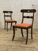 A pair of Regency design mahogany side chairs, early 20th century, with scroll carved crest rail