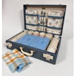 A Brexton mid century picnic case complete with original pink ceramic cups, serving plates, chromium