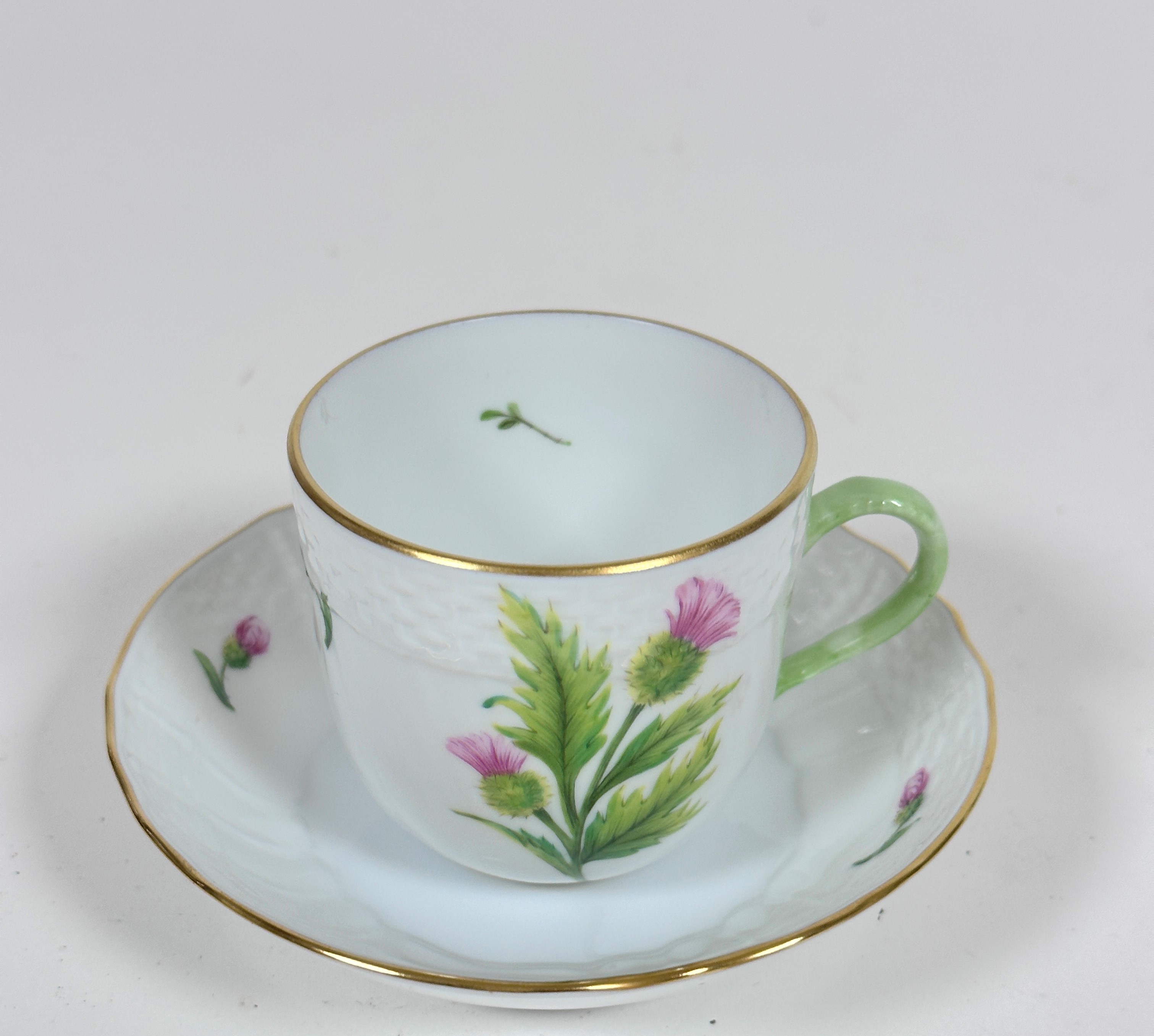 A Hungarian Herend porcelain handpainted Thistle "Cirsium Valgare" with basket weave border, the cup