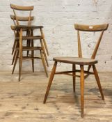 Lucian Ercol for Ercol, A set of four beech and elm stacking chairs, circa 1960's, the back of